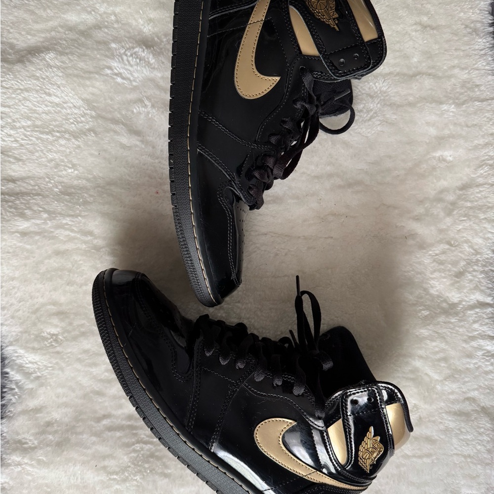 Jordan Black and Gold High-Top Sneakers